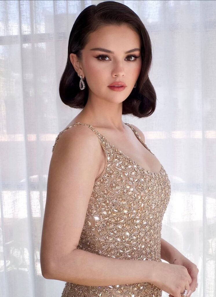 Selena Gomez in gold Oscar De La Renta and matching Jimmy Choo metallic pumps with husband Benny Blanco for Taylor Swift and Travis Kelce's wedding in NYC