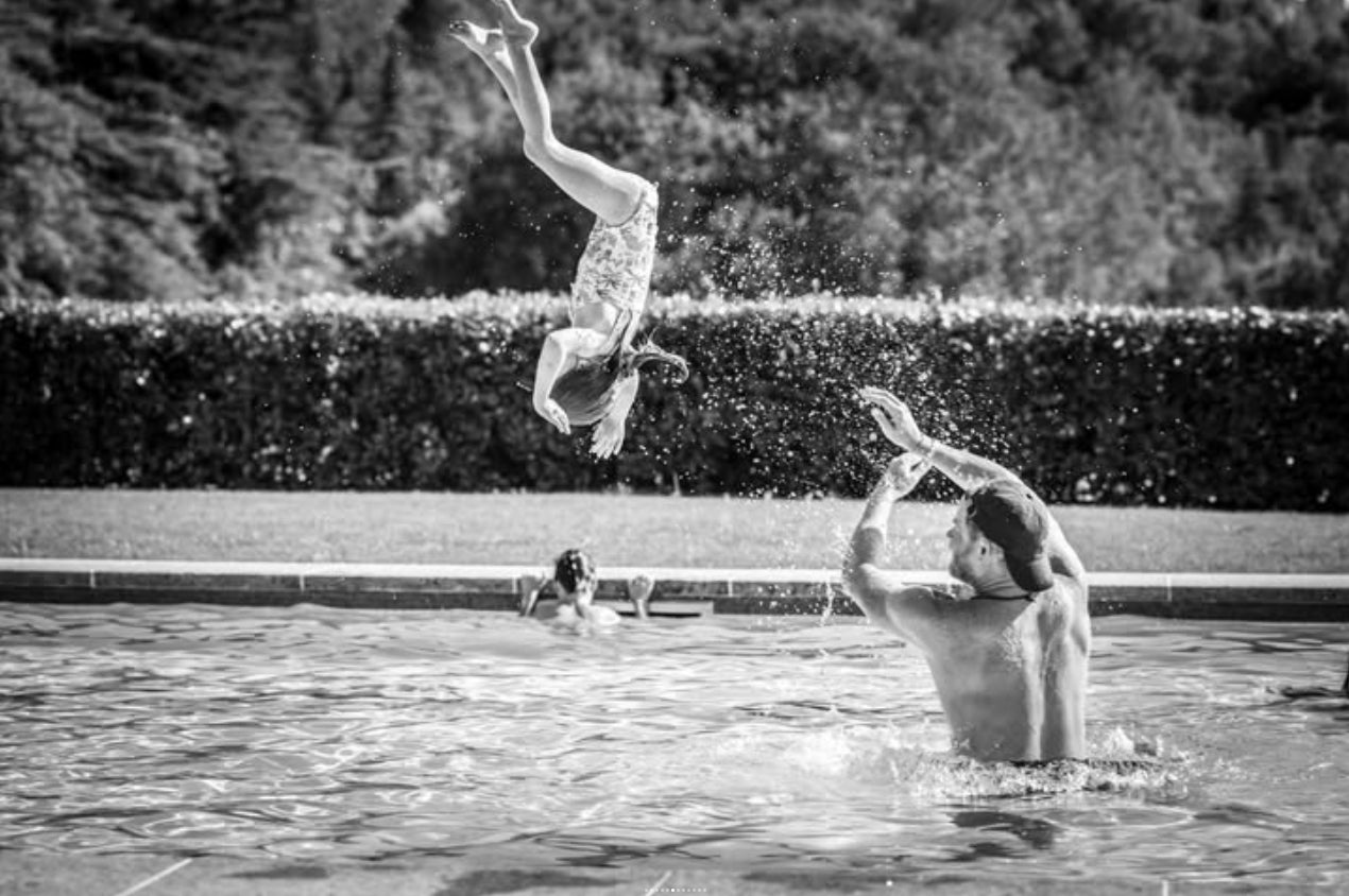 Prince Harry throws Princess Lilibet in swimming pool in family’s summer holiday photos