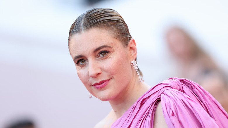 Greta Gerwig in a pink dress