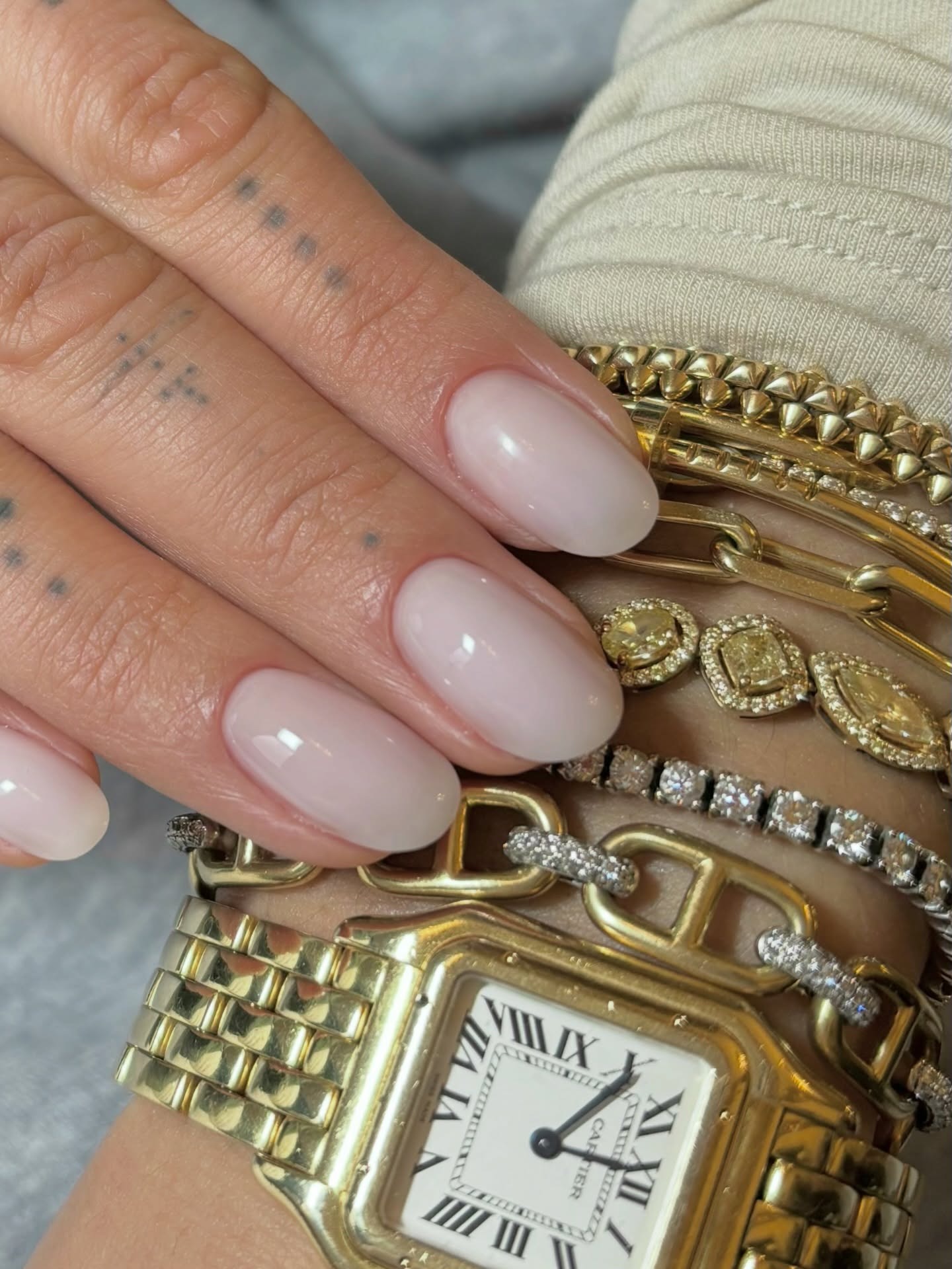 Rita Ora with a milky manicure