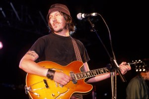 Elliott Smith performs on stage at Leeds Festival, United Kingdom, 1998. He is playing a Gibson ES330 guitar. (Photo by Martyn Goodacre/Getty Images)
