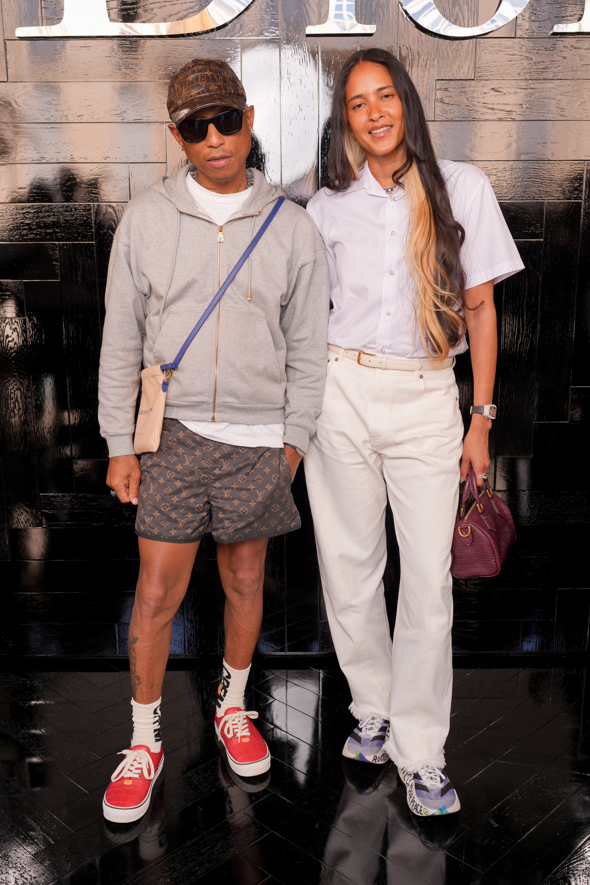 Pharrell Williams and Helen Lasichanh Williams at the Dior show.