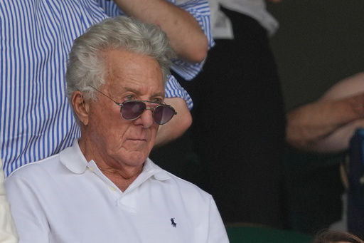 Actor Dustin Hoffman watches a Alexander Zverev of Germany defeats Arthur Fery of Britain during their men