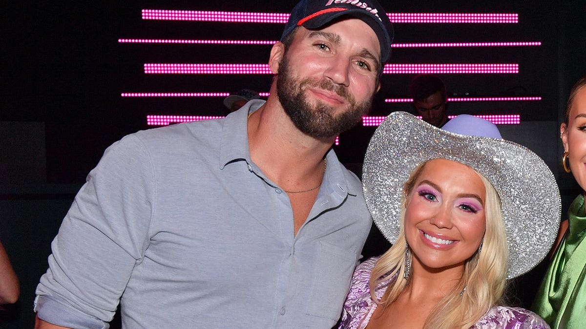 RaeLynn, Brittany Aldean and Jason Aldean stand at a launch party in Nashville.