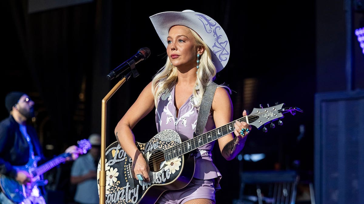 RaeLynn performs on stage at Pine Knob Music Theatre.
