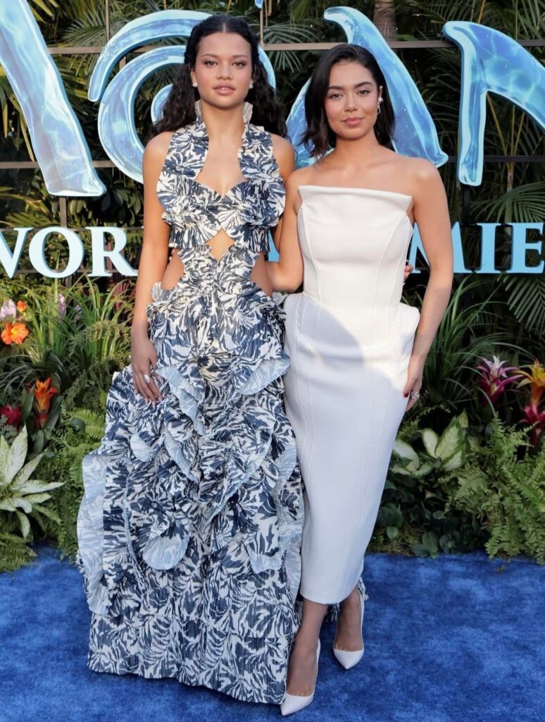 OG Moana voice actress Auli'i Cravalho and live-action Moana actress Catherine Laga'aia pose together at the live-action movie's premiere in Los Angeles (July 7, 2026)