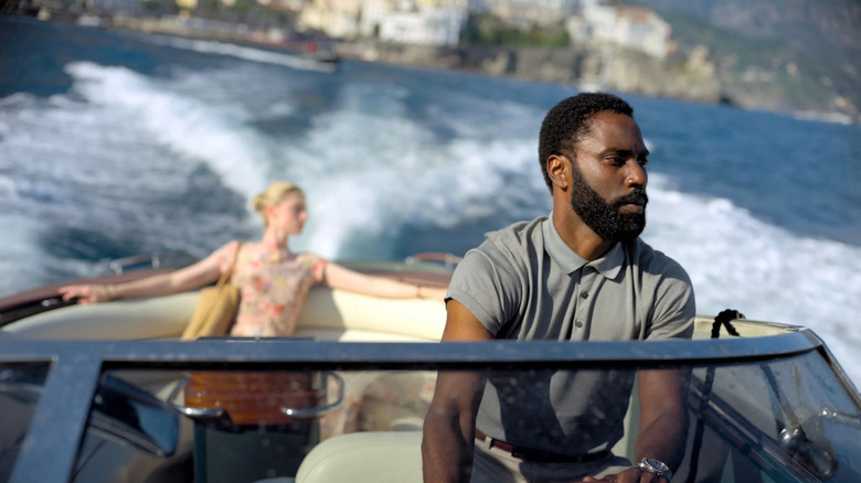 The Protagonist driving Kat in a speed boat in Tenet