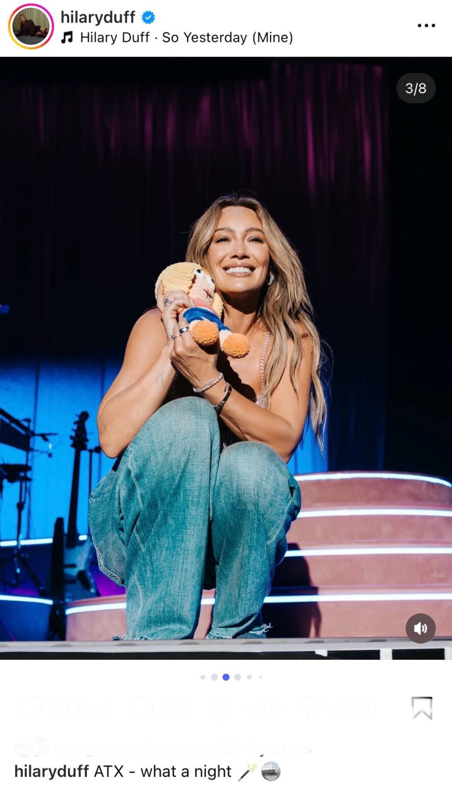 Hilary Duff with a crochet Lizzie McGuire doll at her Austin concert