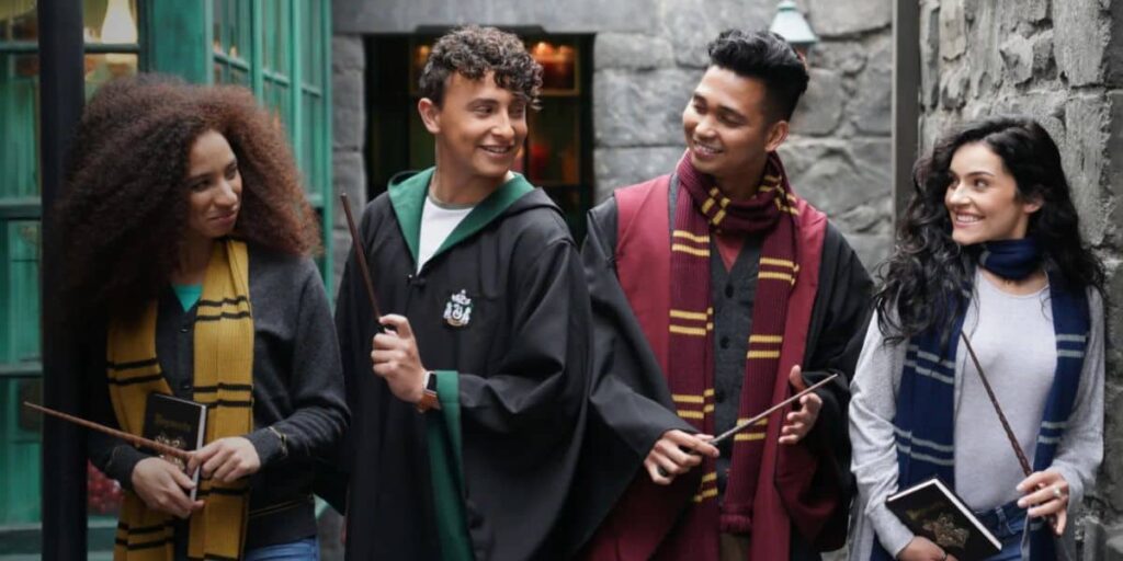 Universal Orlando Permanently Replaces Iconic ‘Harry Potter’ Experience With Pricey Alternative Harry Potter fans in robes with wands in Universal's Diagon Alley