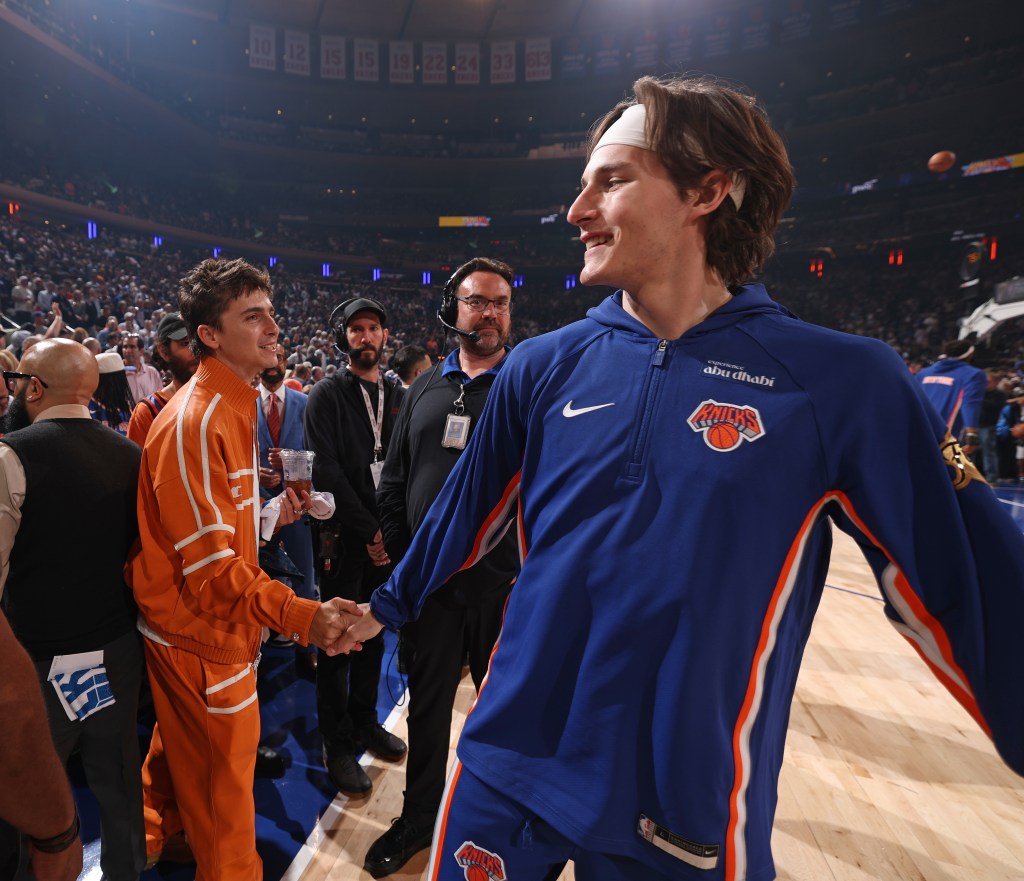 Timothée Chalamet shaking hands with Tyler Kolek of the New York Knicks.