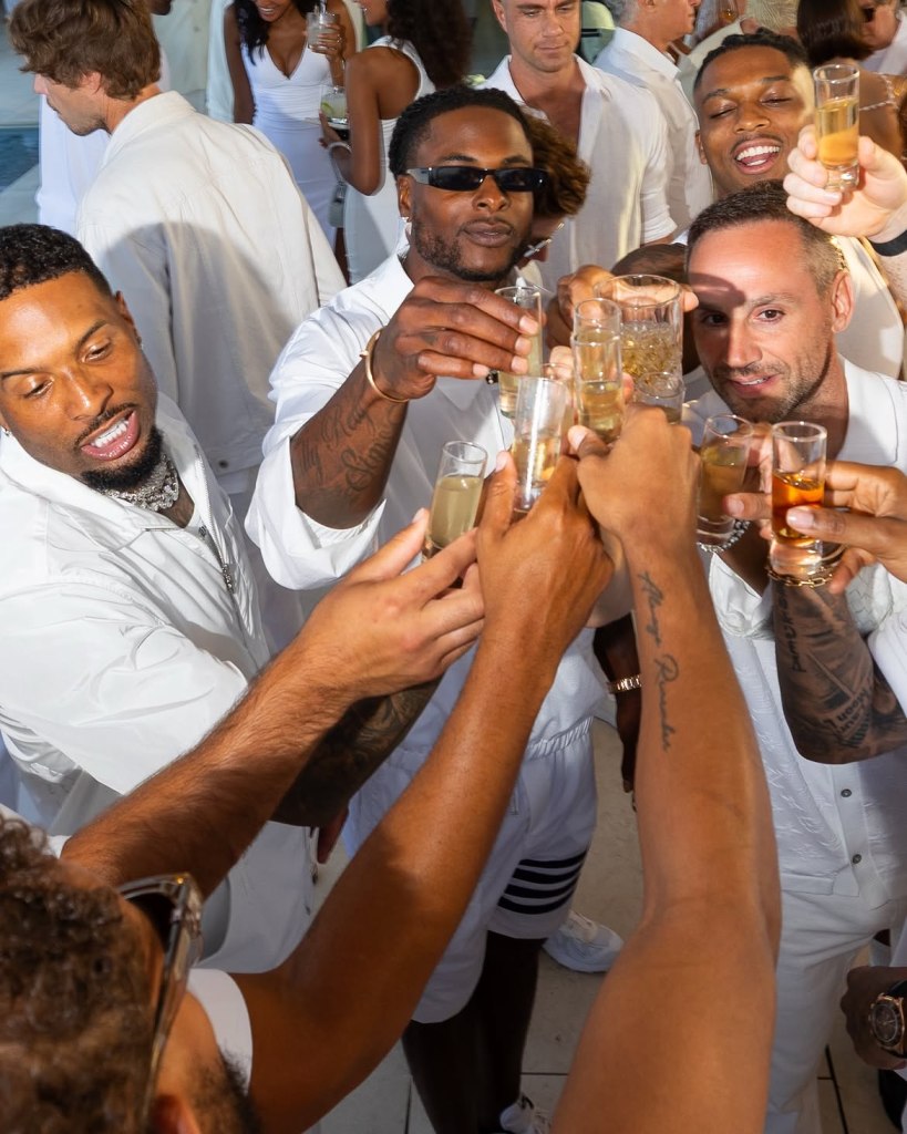 Davante Adams and Michael Rubin attend Michael Rubin's white party in Bridgehampton