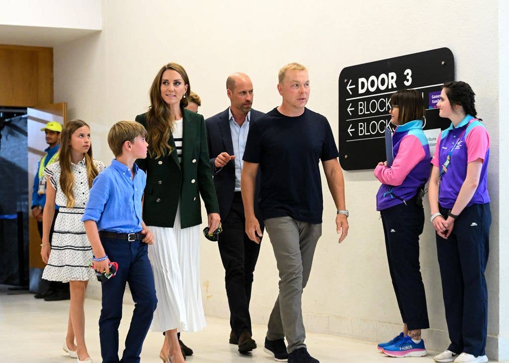 Sir Chris Hoy guides Prince William and Princess Catherine of Wales and their children Prince George, Prince Louis and Princess Charlotte around a building during the Glasgow 2026 Commonwealth Games at  on August 01, 2026 in Glasgow, Scotland. 