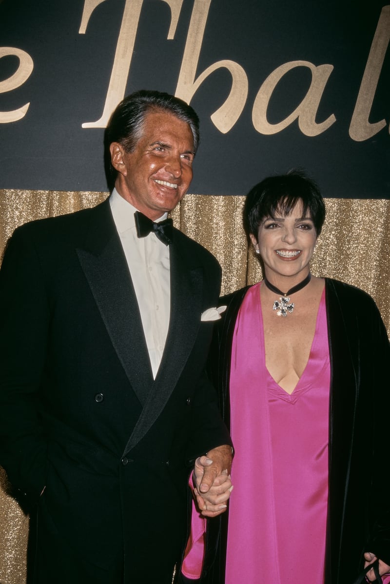 George Hamilton and Liza Minnelli attend the Thalians Awards, where Minnelli was awarded the lifetime achievement award on October 8, 1994.