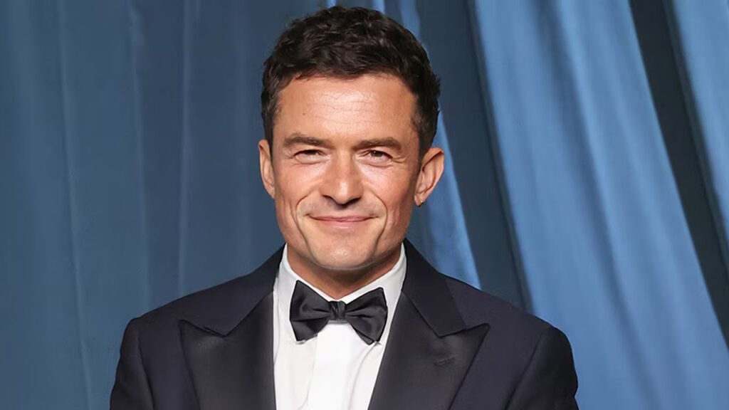 Orlando Bloom Shows Off Rock-Solid Abs During Family Getaway