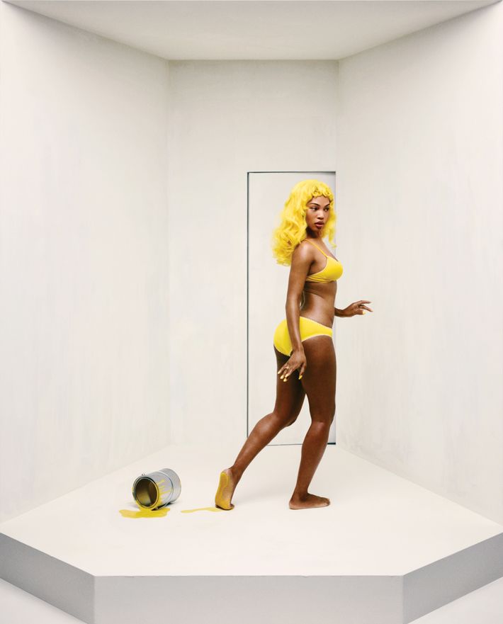 Quenlin Blackwell wears a yellow wig in an Araks bra and panty set.
