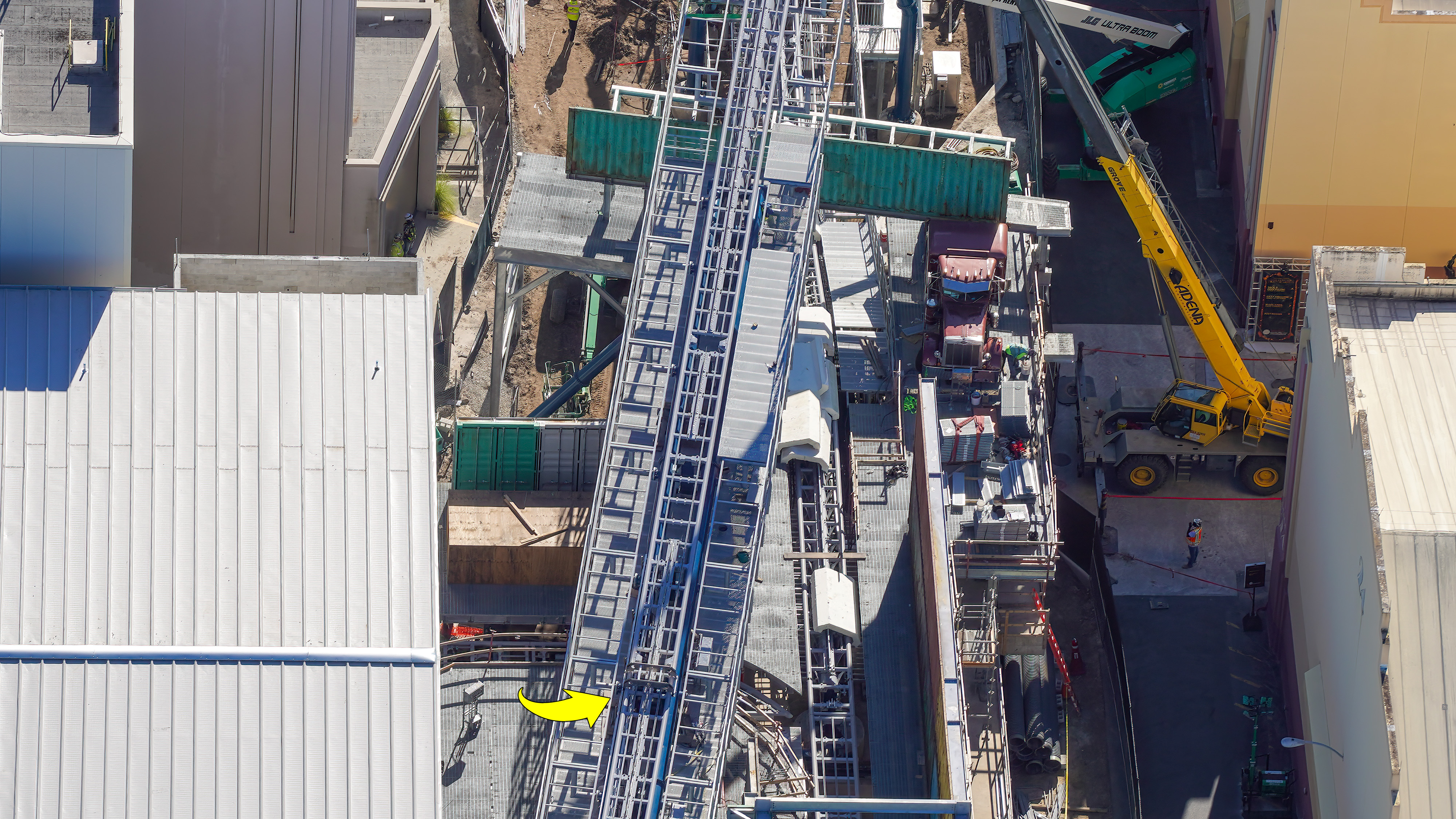 Crews are fine-tuning track components and completing waterfront pavement around Fast & Furious: Hollywood Drift at Universal Studios Florida, as new photos offer a closer look inside the coaster’s station and surrounding construction site.